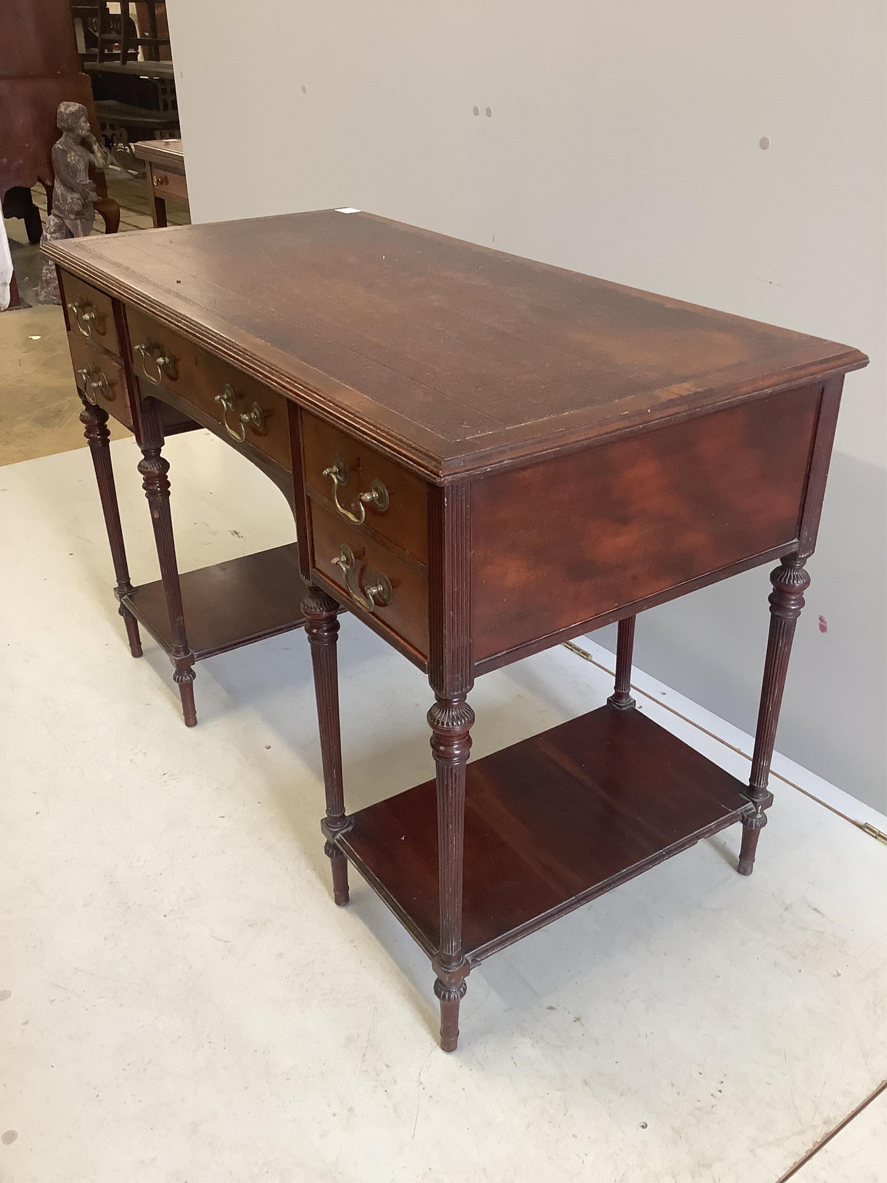 A late Victorian mahogany kneehole writing table by Collinson & Lock, width 109cm, depth 55cm, height 74cm. Condition - fair to good